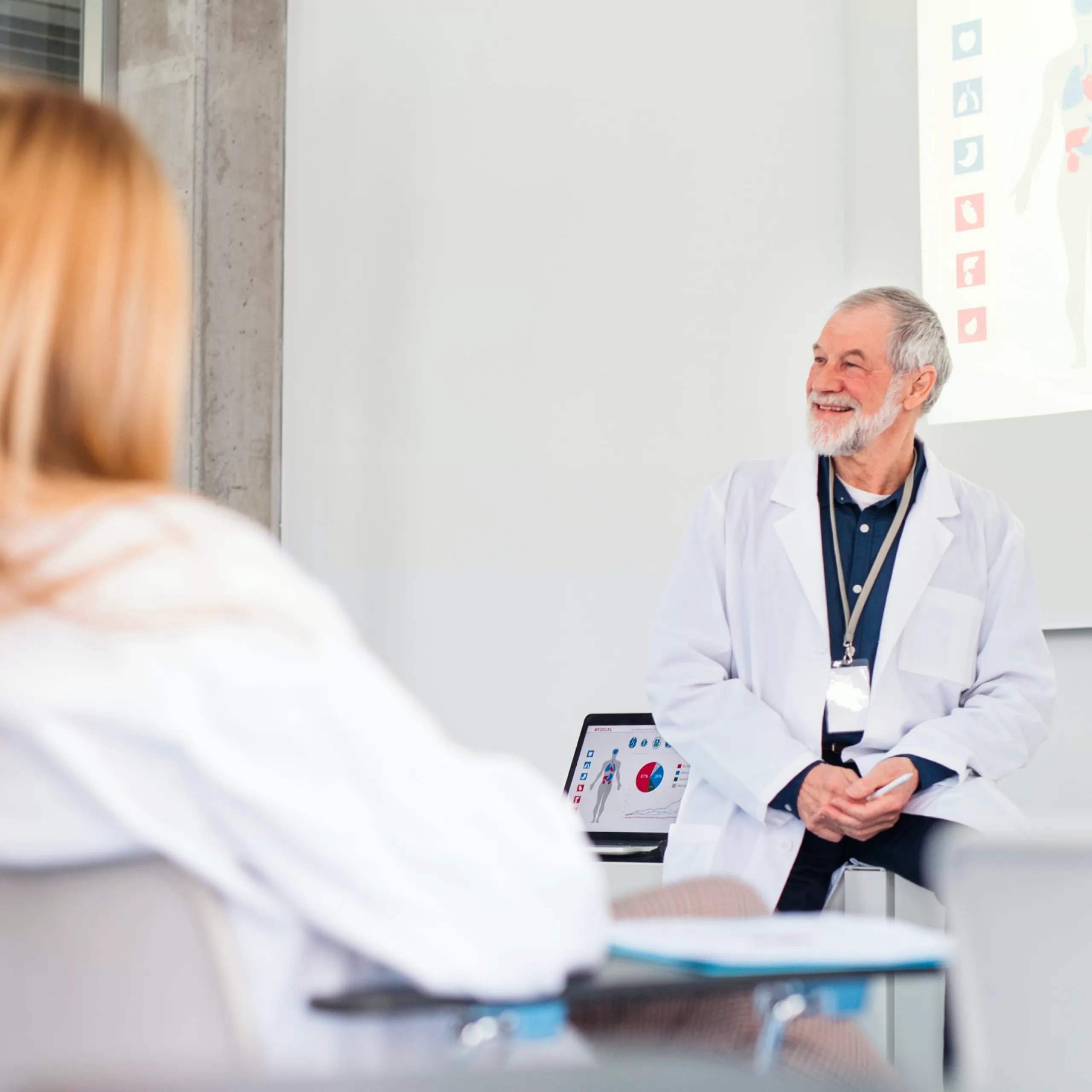 Smiling doctor discussing human genome with his colleagues
